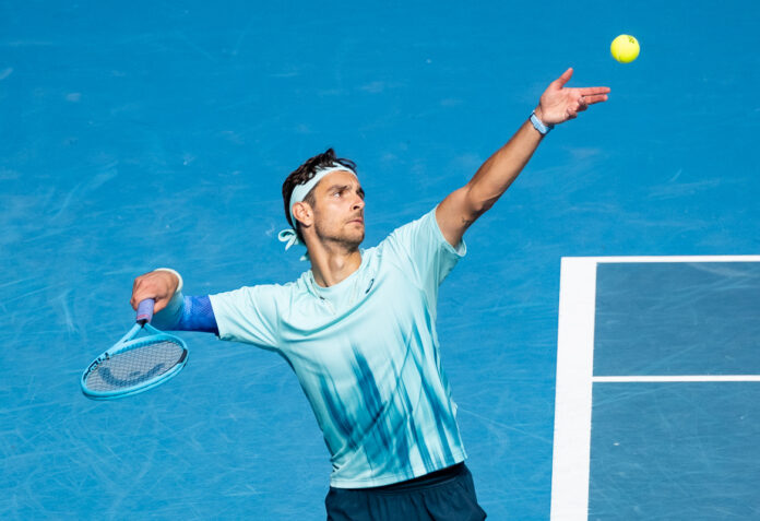 Musetti from Italy Serving at the Australian Open