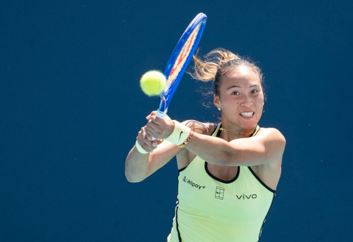 Qinwen Zheng of China returns a shot to Sloane Stephens of the United States at Miami Open