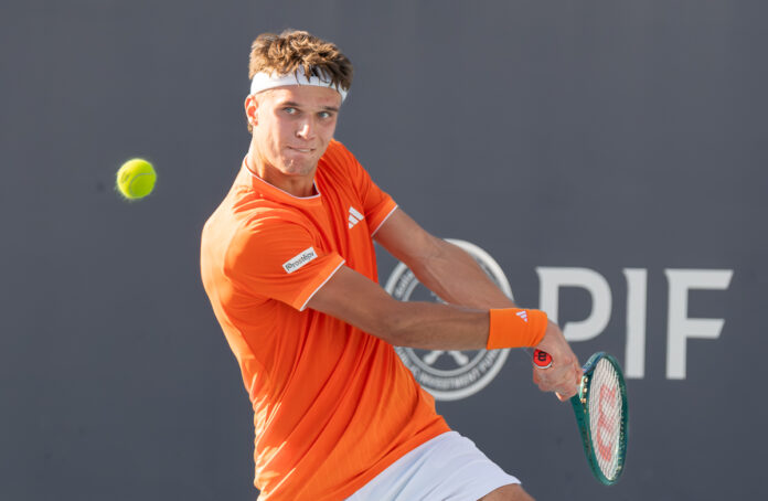 Jakub Mensik of the Czech Republic returns a shot against Frances Tiafoe at Miami Open