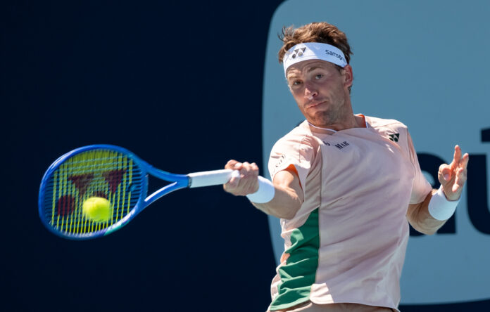 Casper Ruud of Denmark hits a return at the Miami Open