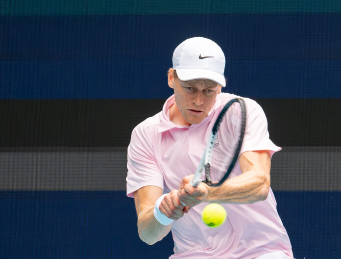 Jannik Sinner from Italy hits a return at the Miami Open