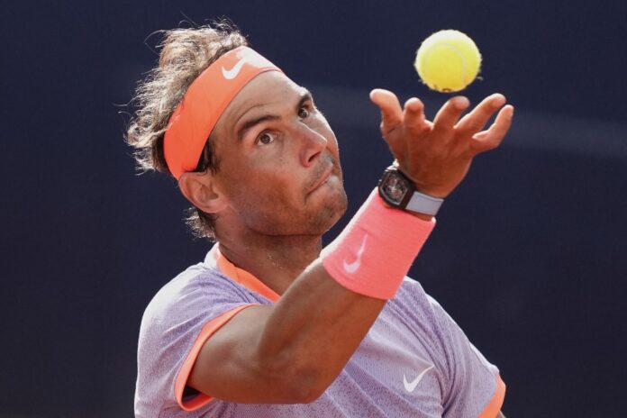 Spain's Rafael Nadal serves the bal