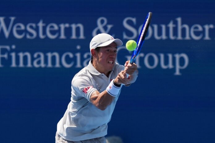 Kei Nishikori of Japan returns a volley