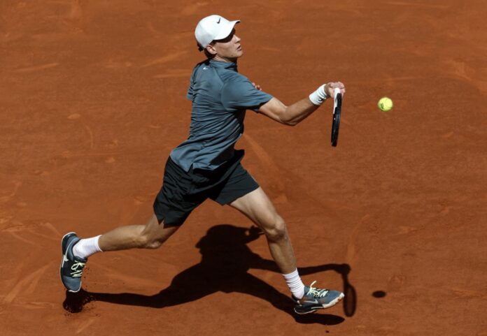 Italy's Jannik Sinner returns a ball on Clay Court