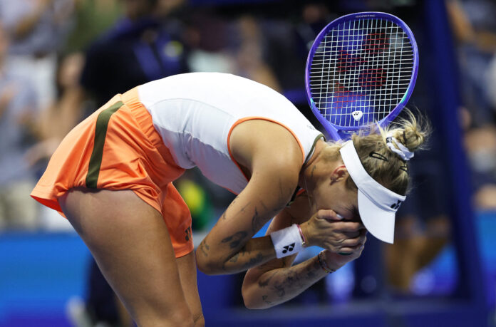 Vondrousova of Czechia hands in face