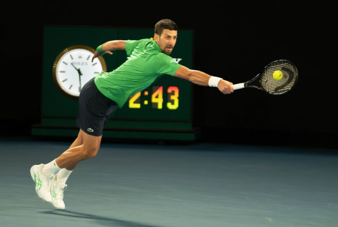 Novak Djokovic lunges for a return at the 2026 Australian Open