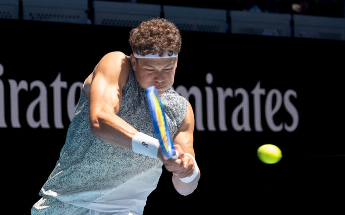 American Ben Shelton hits a return at the Australian Open 2026