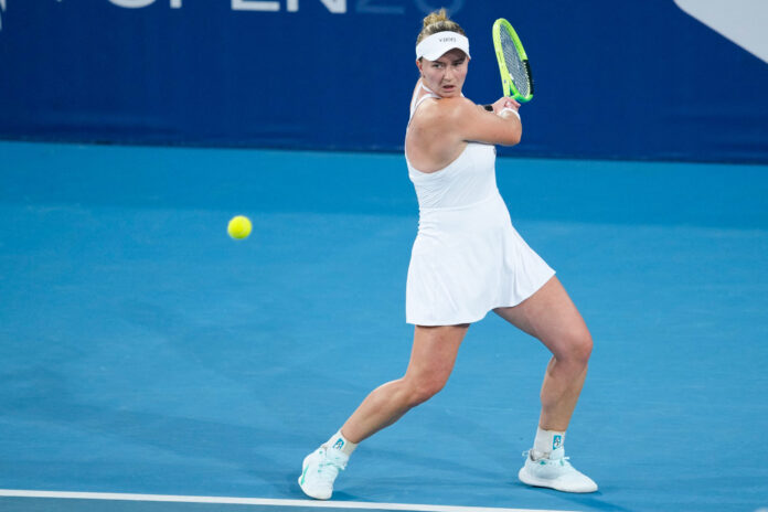 Barbora Krejcikova plays a backhand during a WTA tournament match