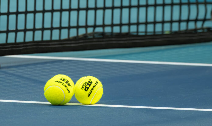 Two Dunlop ATP Tour tennis balls on the hard court at the Miami Open, 2026