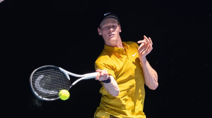 Jannik Sinner Hits a return at the Australian Open