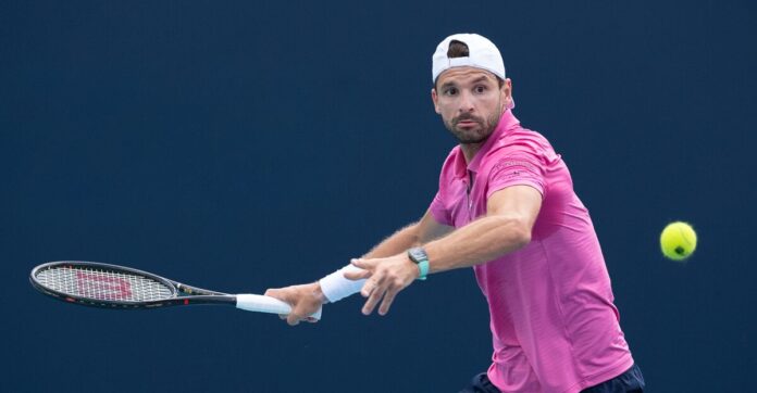 Grigor Dimitrov hitting a return at the Miami Open