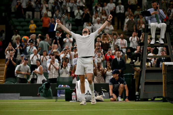 Kazakhstan's Alexander Bublik celebrates winning at against Tiafoe at Wimbledon