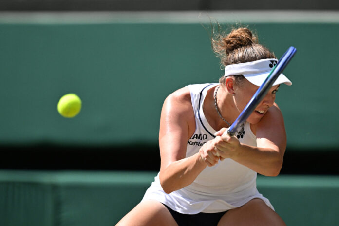 Czech Republic's Linda Noskovahits a return at Wimbledon 2026