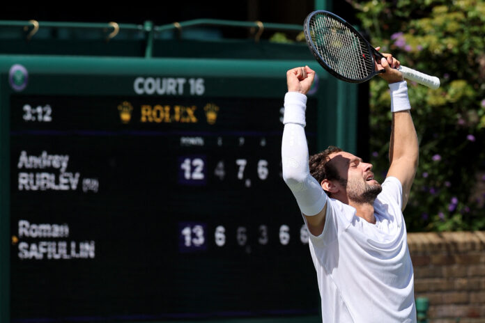 Roman Safiullin serves during a men's singles match at the 2026 Championships, Wimbledon.