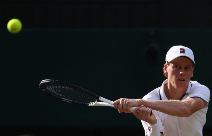 Jannik Sinner hits a return during his 2026 Wimbledon semifinal win over Novak Djokovic on Centre Court