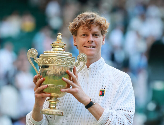 Jannik Sinner with the Wimbledon trophy after his four-set win over Alexander Zverev, Centre Court, All England Club, 12 July 2026. His fifth Grand Slam title and second straight at the All England Club.