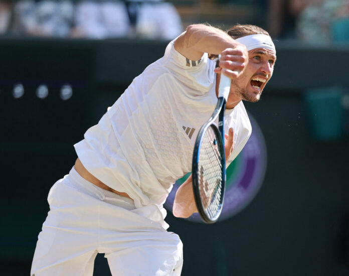 Alexander Zverev of Germany serves against Taylor Fritz at Wimbledon