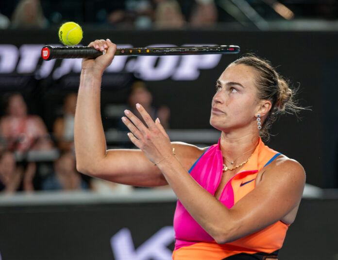 Sabalenka balances the tennis ball on her racket at the Australian Open