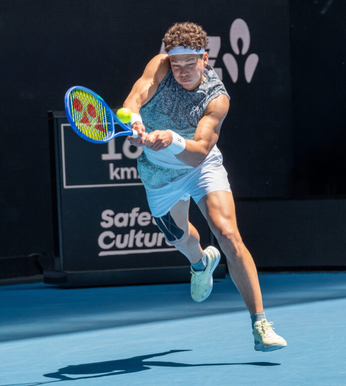 Ben Shelton lunges to hit a return at the Australian Open