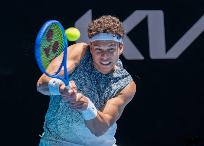 Closeup of Ben Shelton hitting a return at the Australian Open
