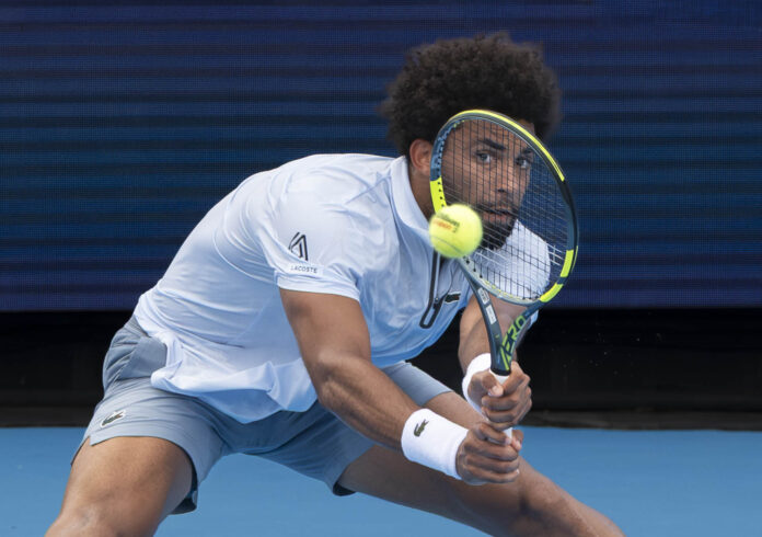 Arther Fils looks through his racket on a return at the Cincinnati Open
