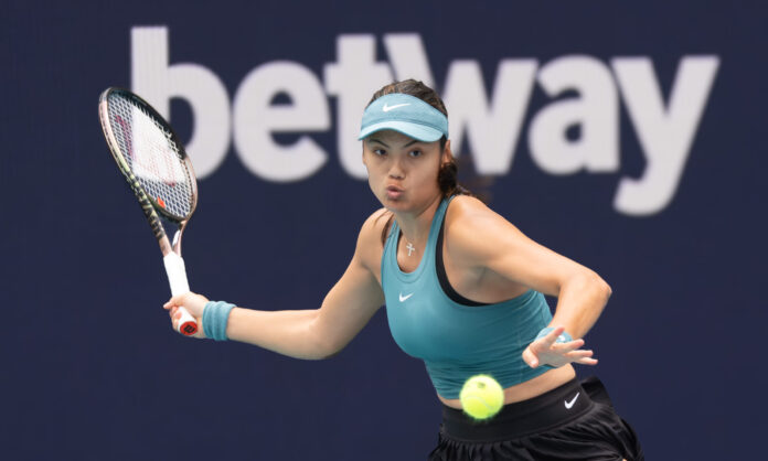 Emma Raducanu hits a forehand return at the Miami Open