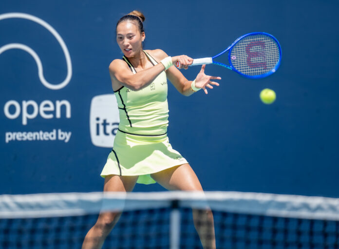 Zheng Qinwen of China hits a return at the Miami Open