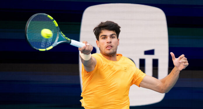 Carlos Alcaraz hits a forehand return on the hard courts at the Miami Open in March 2026