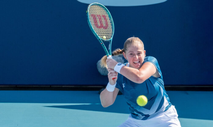 Jelena Ostapenko of Latvia returns a shot at the Miami Open