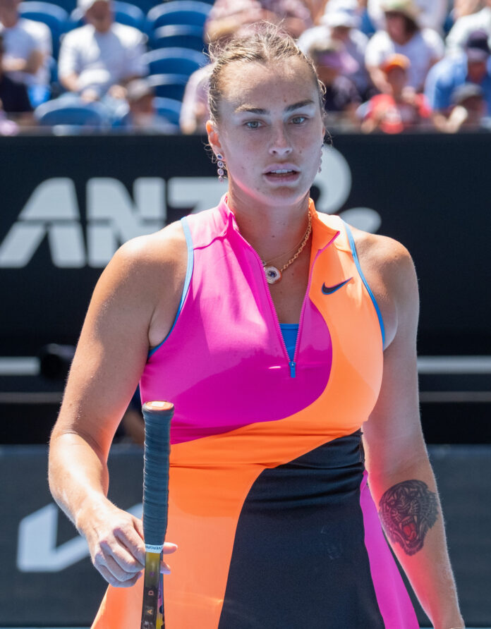 Aryna Sabalenka pauses between points on a hard court at the 2026 Australian Open