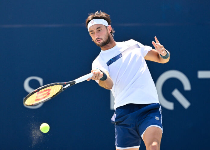 Thiago Agustin Tirante hits a forehand on an outdoor hard court