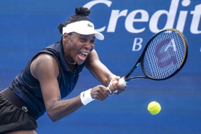 Venus Williams tries to hit a return at the Cincinnati Open