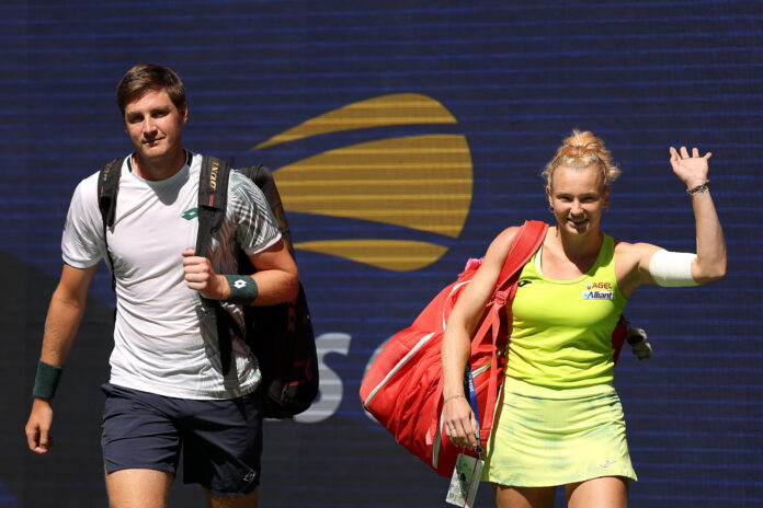 Henry Patten of the United Kingdom and Katerina Siniakova of Czechia walk on court at the US Open 2026