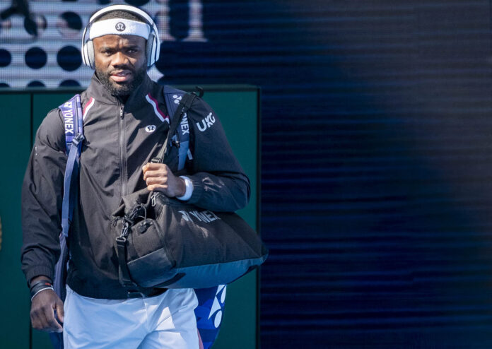 Frances Tiafoe carrying a racquet bag and a duffel as he walks out at the 2026 Cincinnati Open