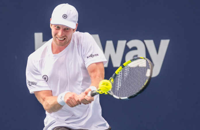 Botic van de Zandschulp of the Netherlands plays a backhand at the Miami Open 2023