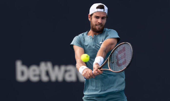 Karen Khachanov hits a return at the Miami Open