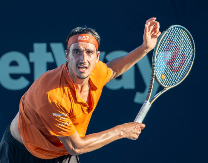Lorenzo Sonego of Italy serves at Miami Open 2023