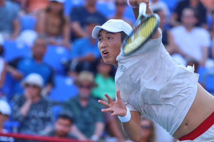 Shang Juncheng of China plays a backhand