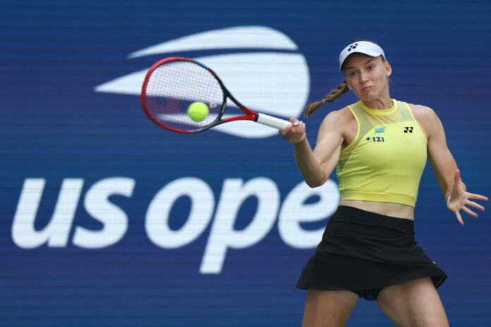 Elena Rybakina of Kazakhstan returns a shot against Qinwen Zheng of China
