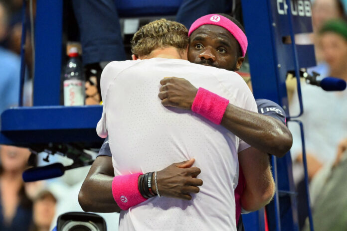USA's Alex Michelsen (L) becomes emotional after losing to Tiafoe at the US Open