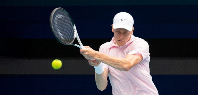 Jannik Sinner hits a high return at the Miami Open