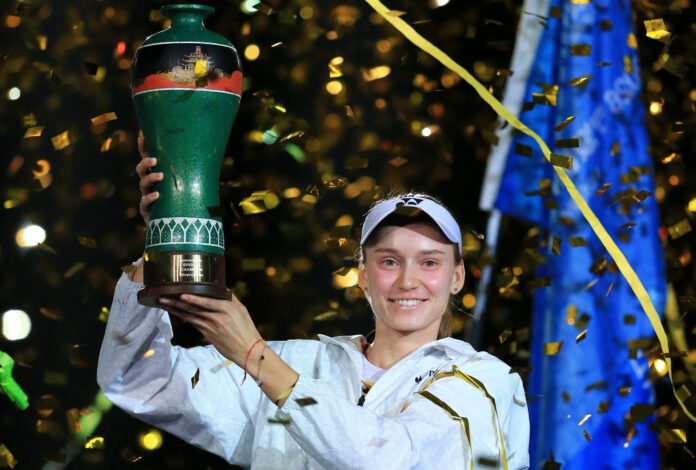 Kazakhstan's Elena Rybakina celebrates with trophy at the Ningbo Open tennis tournament