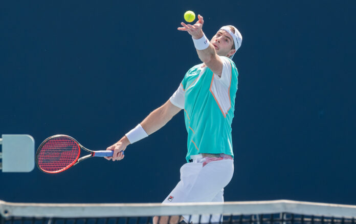 John Isner serves at the Miami Open 2022