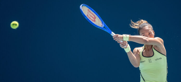 Zheng Qinwen hits a high return at the Miami Open 2026