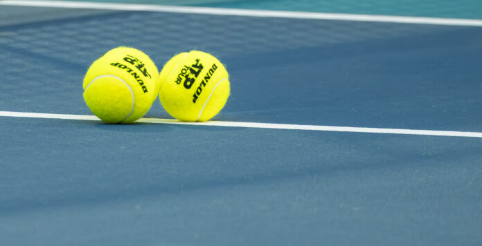 ATP Tennis balls on a hard court
